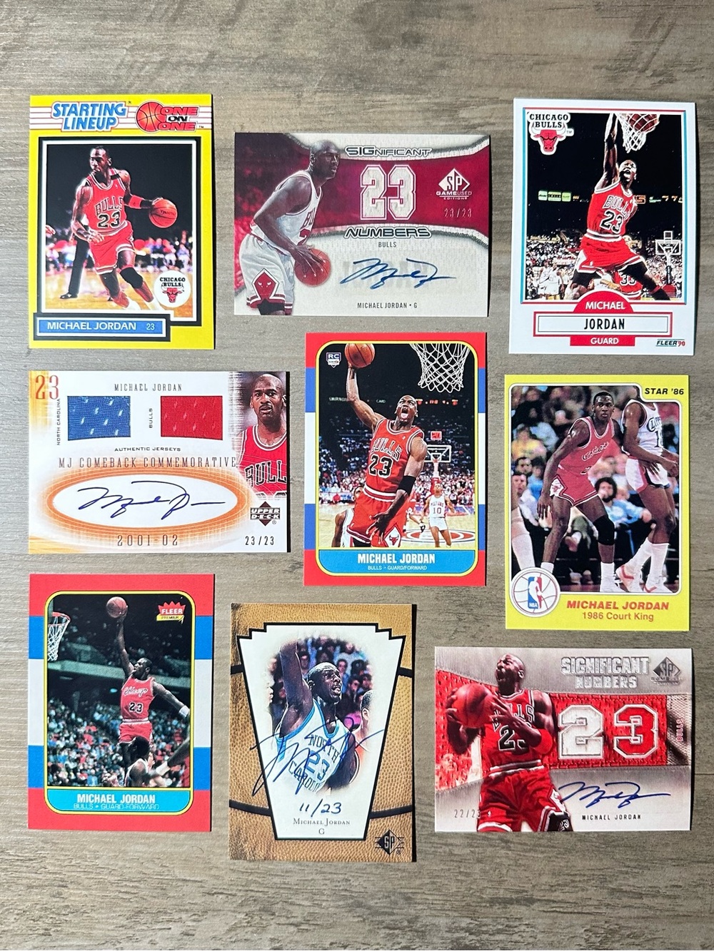 Michael Jordan Signed Rookie Lot of (9) Star UD Starting Lineup Novelty Cards.